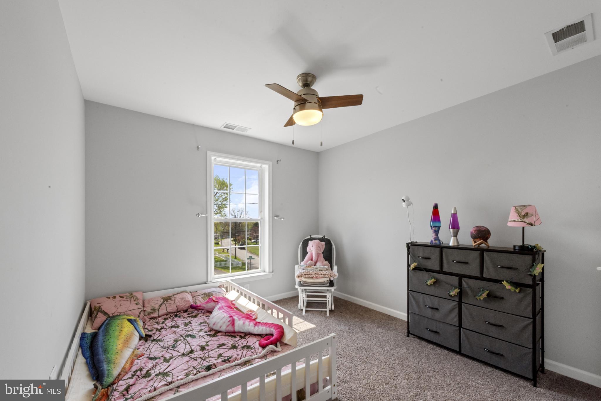 910 Rosedale Avenue Rosedale, MD 21237 - Photo 26 of 41 a bedroom with a bed and a window