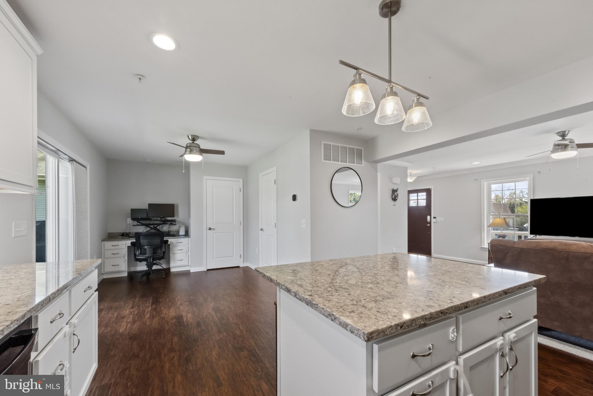 910 Rosedale Avenue Rosedale, MD 21237 - Photo 10 of 41 a kitchen with a table chairs and wooden floor
