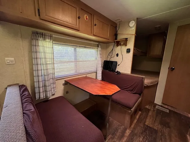 a bathroom with a sink a mirror and vanity