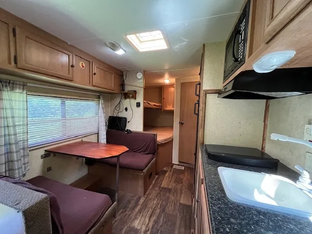 a living room with furniture and a painting