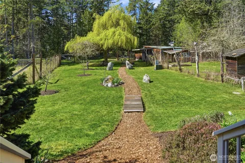 a view of a house with a backyard