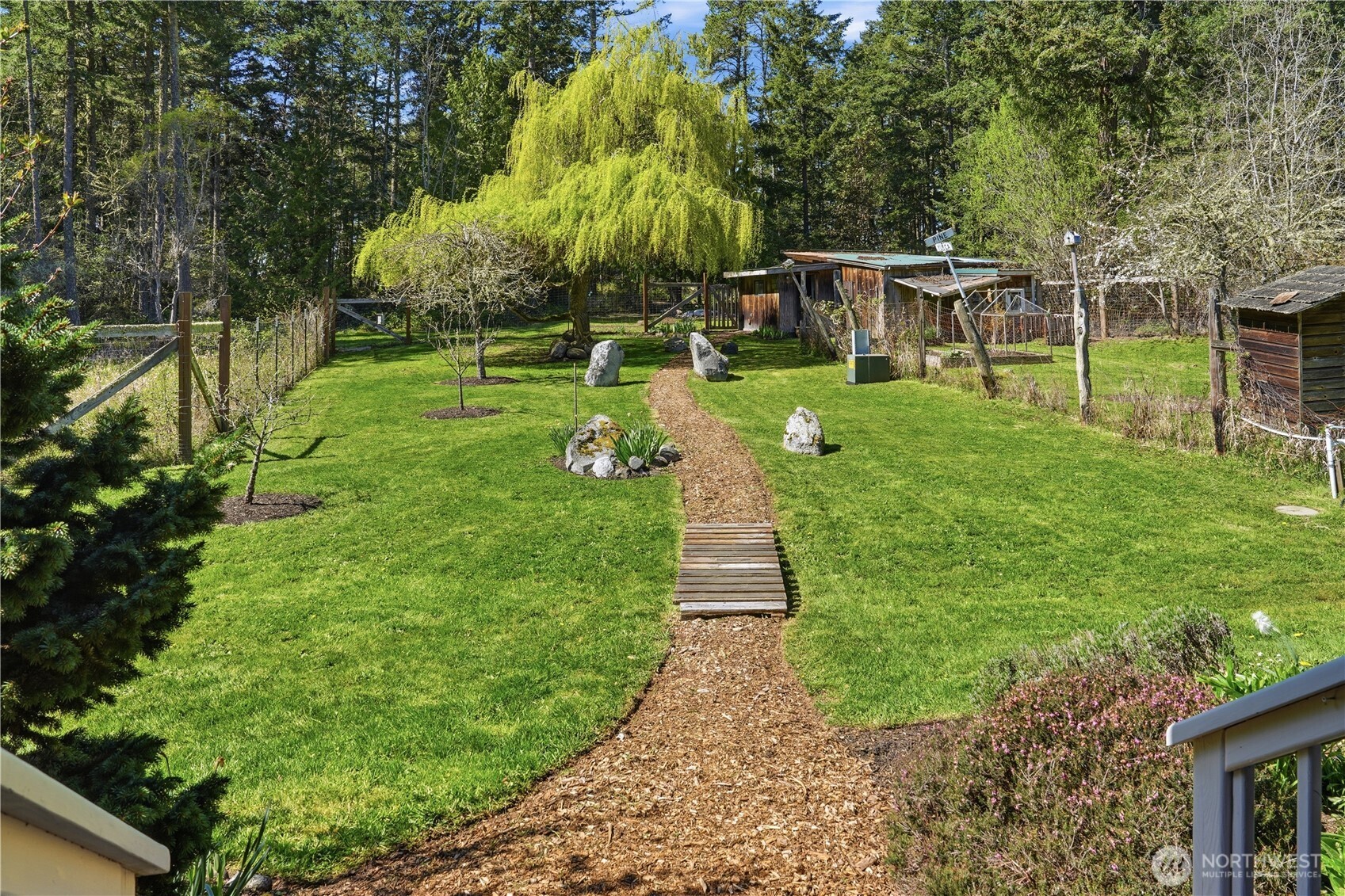 1763 Center Road Lopez Island, WA 98261 - Photo 22 of 40 a view of a house with a backyard