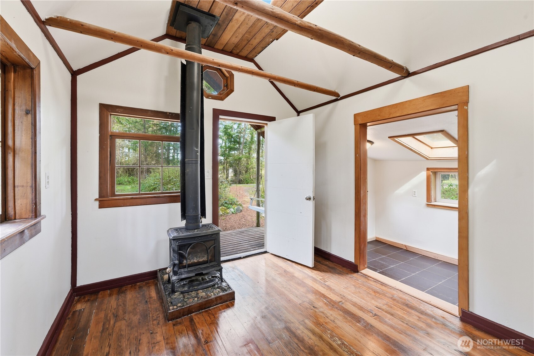1763 Center Road Lopez Island, WA 98261 - Photo 29 of 40 an empty room with wooden floor and windows