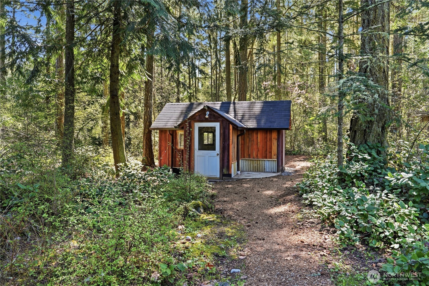 1763 Center Road Lopez Island, WA 98261 - Photo 31 of 40 a view of a house with large tree and wooden fence