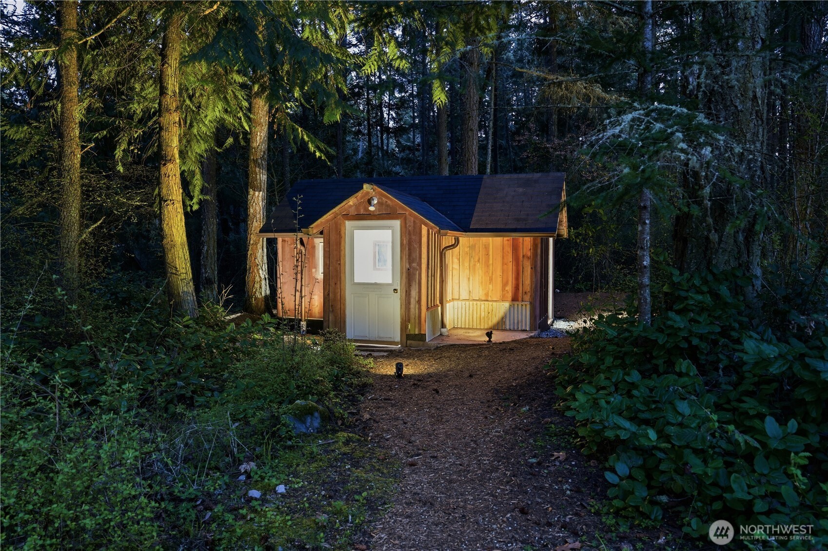 1763 Center Road Lopez Island, WA 98261 - Photo 33 of 40 a front view of a house with garden