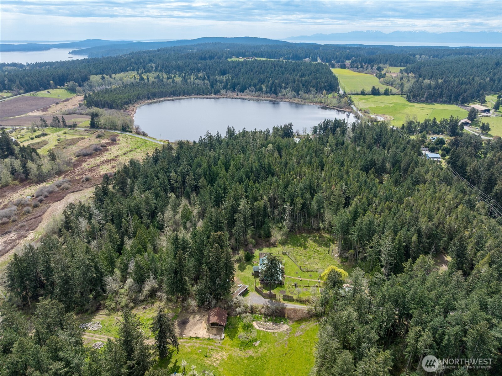 1763 Center Road Lopez Island, WA 98261 - Photo 34 of 40 a view of a lake with a mountain