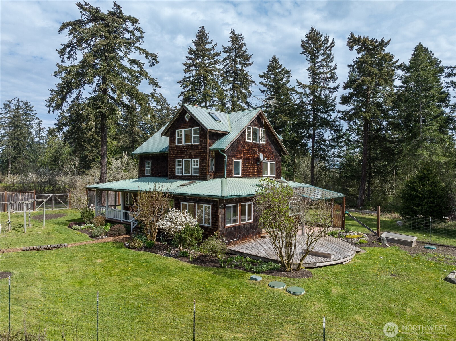 1763 Center Road Lopez Island, WA 98261 - Photo 36 of 40 a view of a house with backyard and sitting area