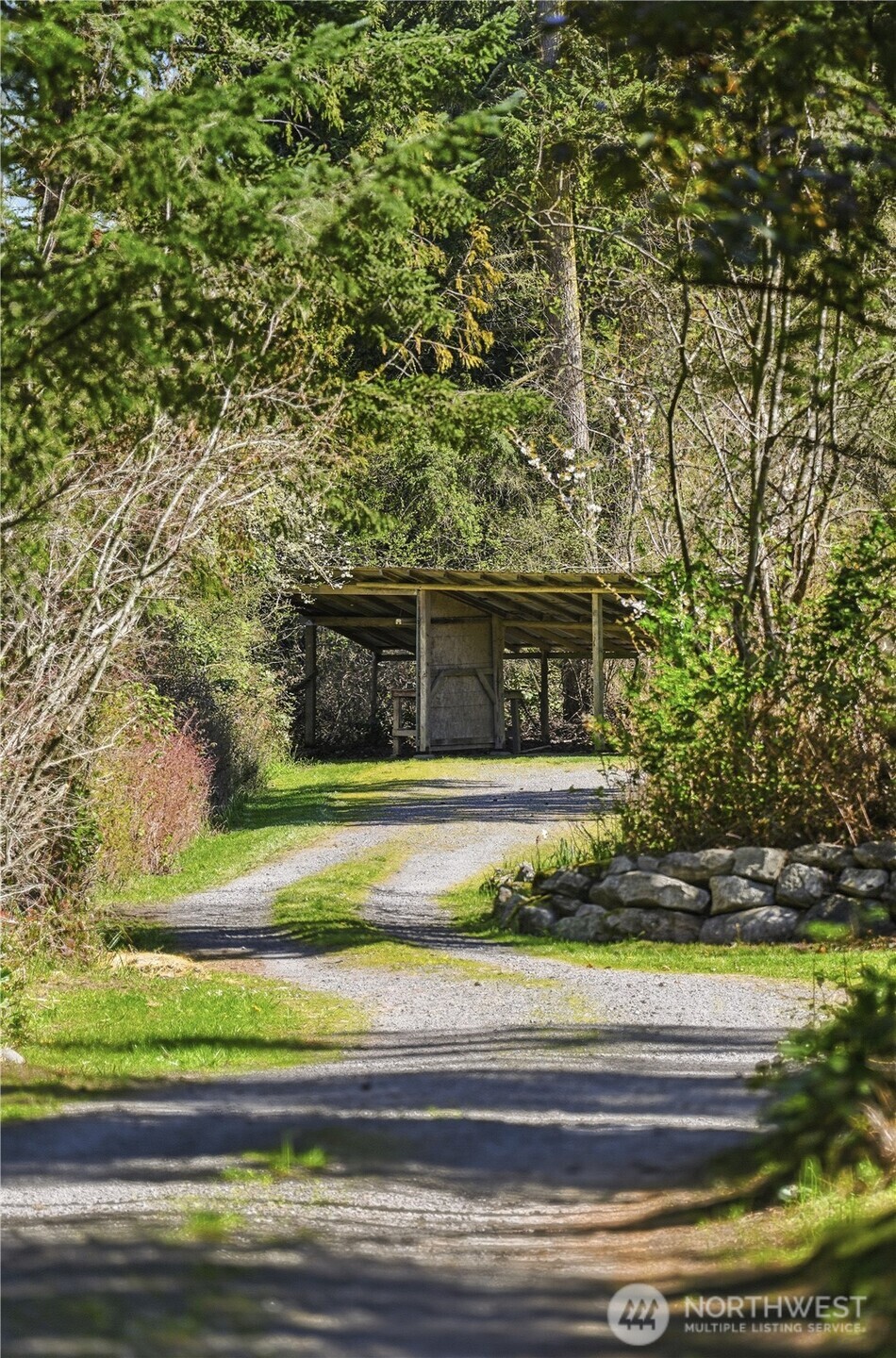 1763 Center Road Lopez Island, WA 98261 - Photo 38 of 40 a front view of a house with a yard