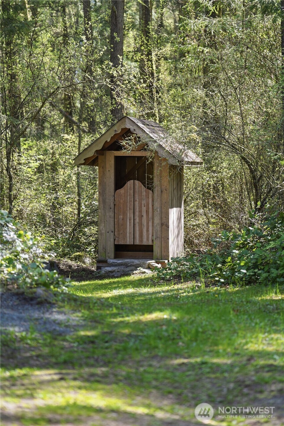 1763 Center Road Lopez Island, WA 98261 - Photo 39 of 40 a house with a yard