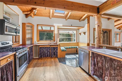 a outdoor space with wooden floors and brick walls