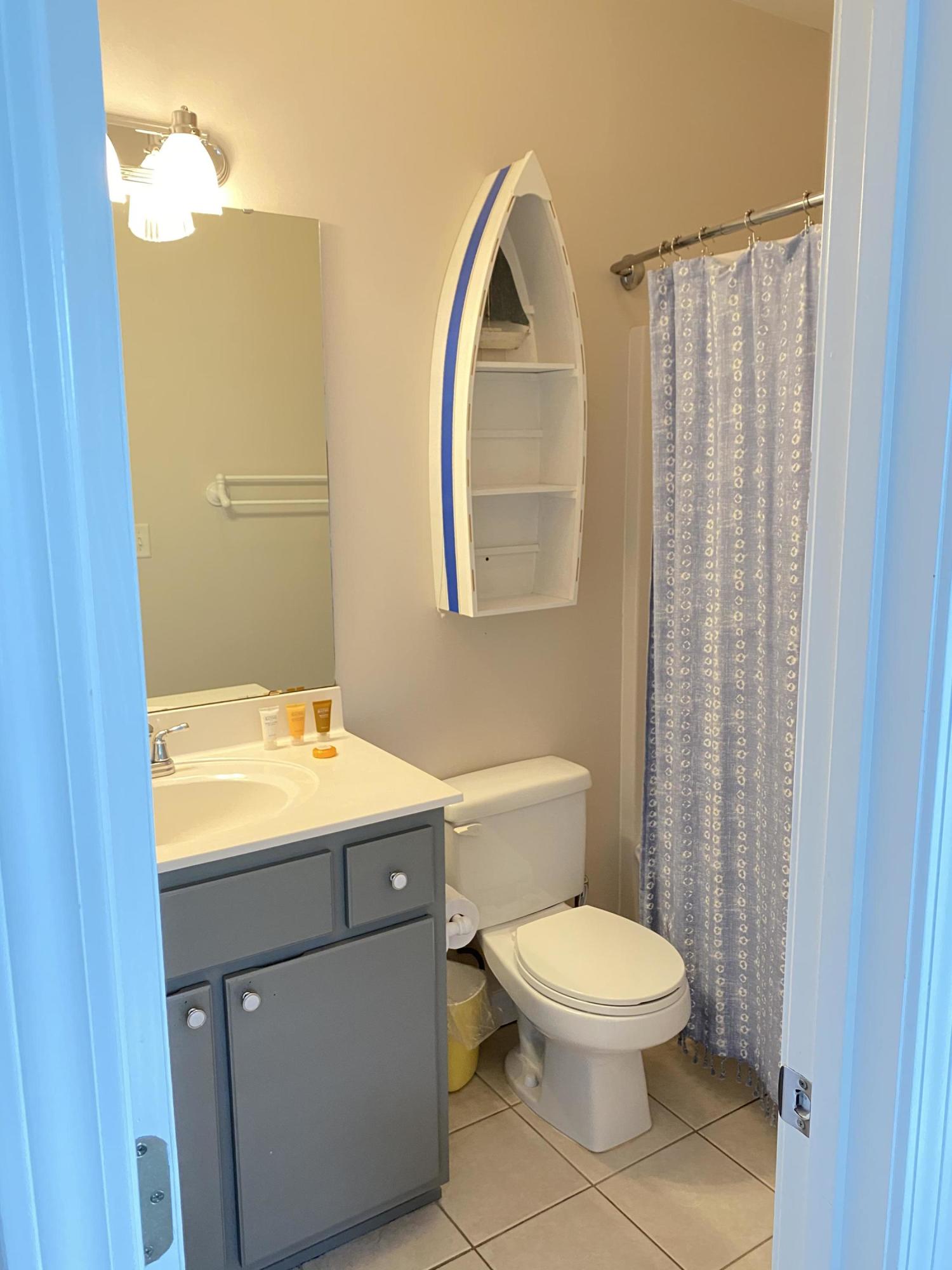 57 Emerald Dunes Circle Santa Rosa Beach, FL 32459 - Photo 14 of 26 a bathroom with a sink a toilet and shower
