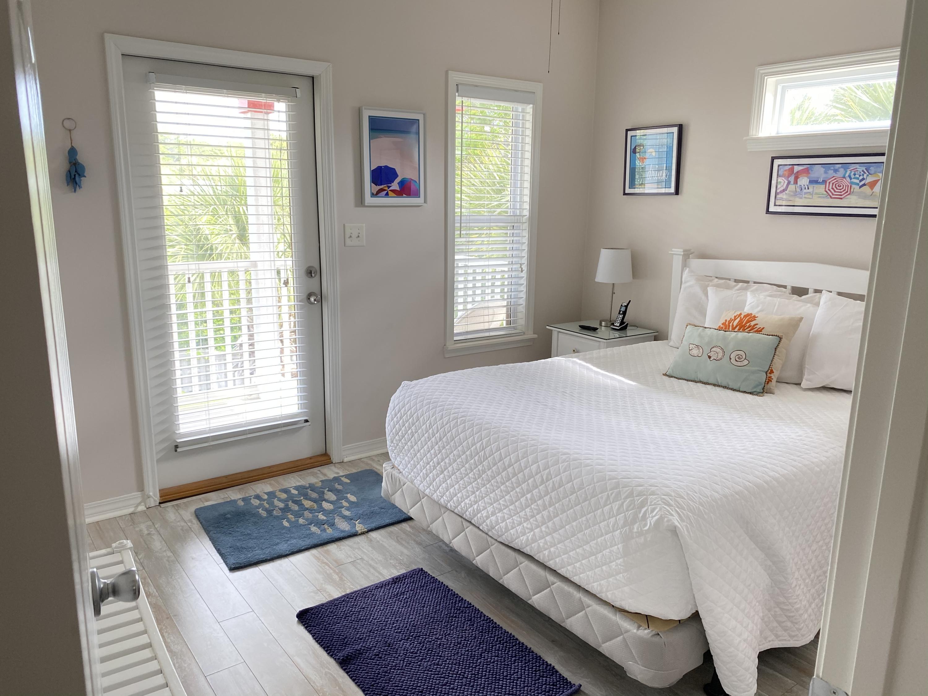 57 Emerald Dunes Circle Santa Rosa Beach, FL 32459 - Photo 15 of 26 a bedroom with a bed and a window