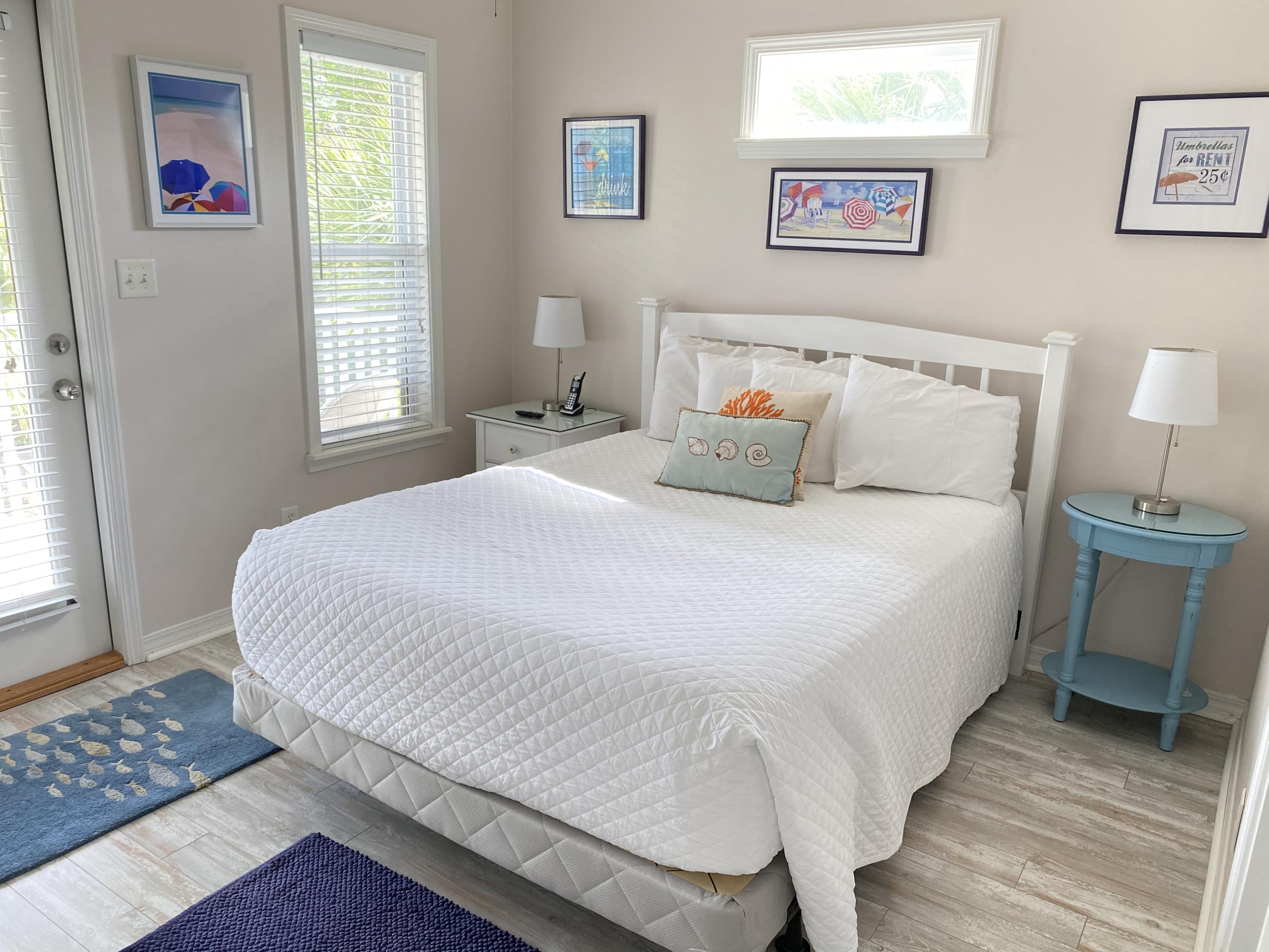 57 Emerald Dunes Circle Santa Rosa Beach, FL 32459 - Photo 16 of 26 a large white bed in a white room