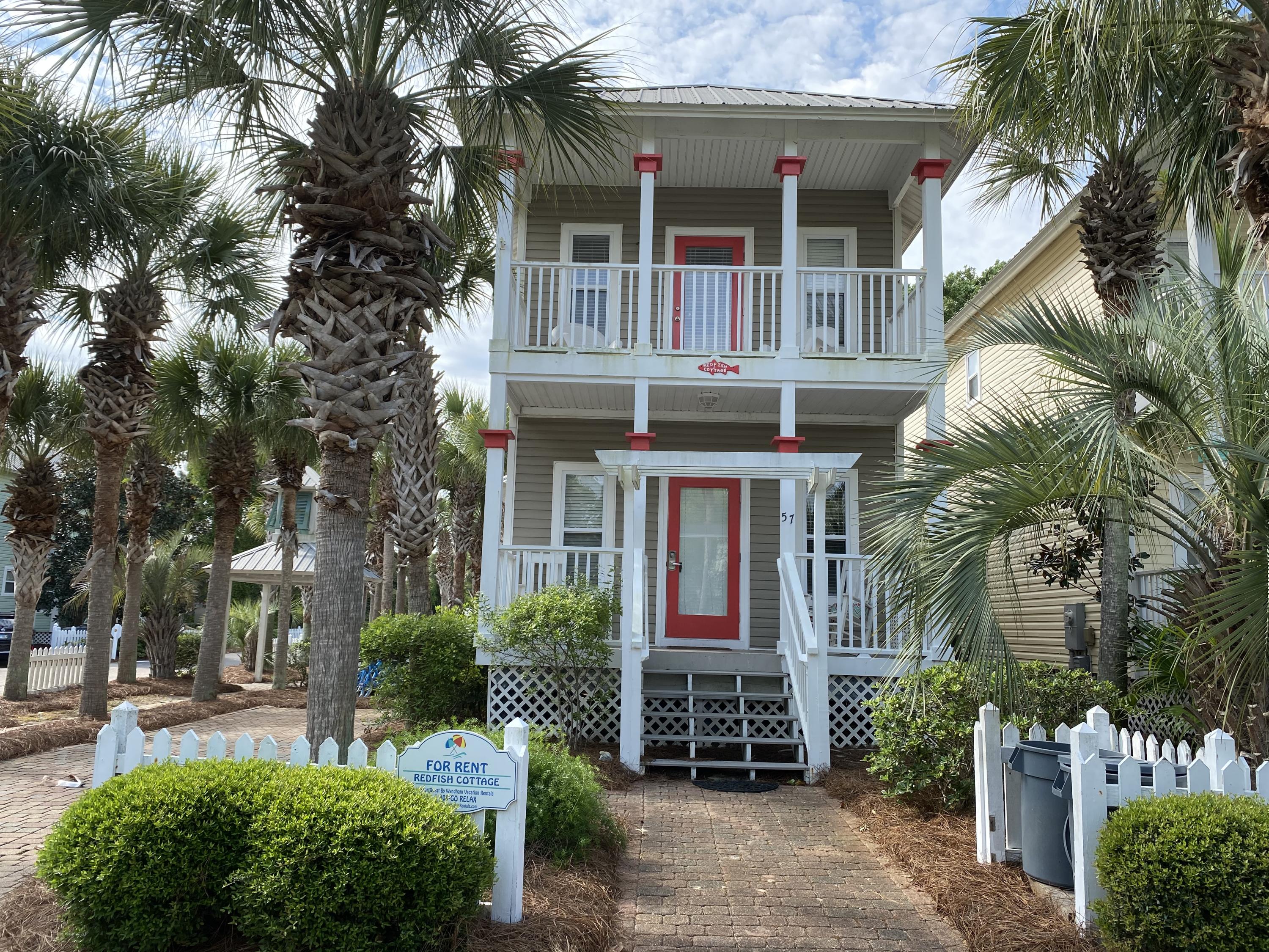 57 Emerald Dunes Circle Santa Rosa Beach, FL 32459 - Photo 2 of 26 a front view of a house with garden