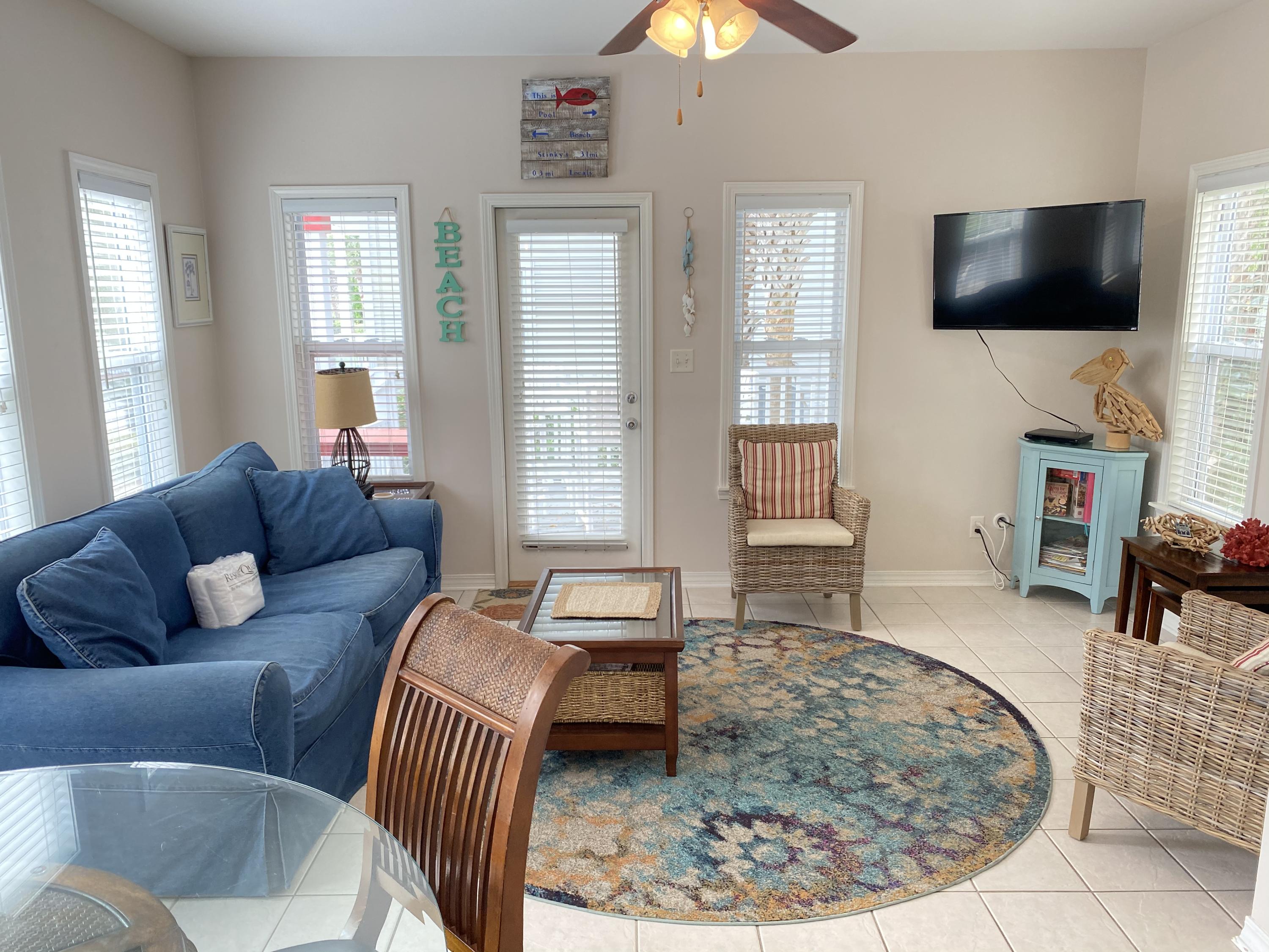 57 Emerald Dunes Circle Santa Rosa Beach, FL 32459 - Photo 3 of 26 a living room with furniture and a flat screen tv