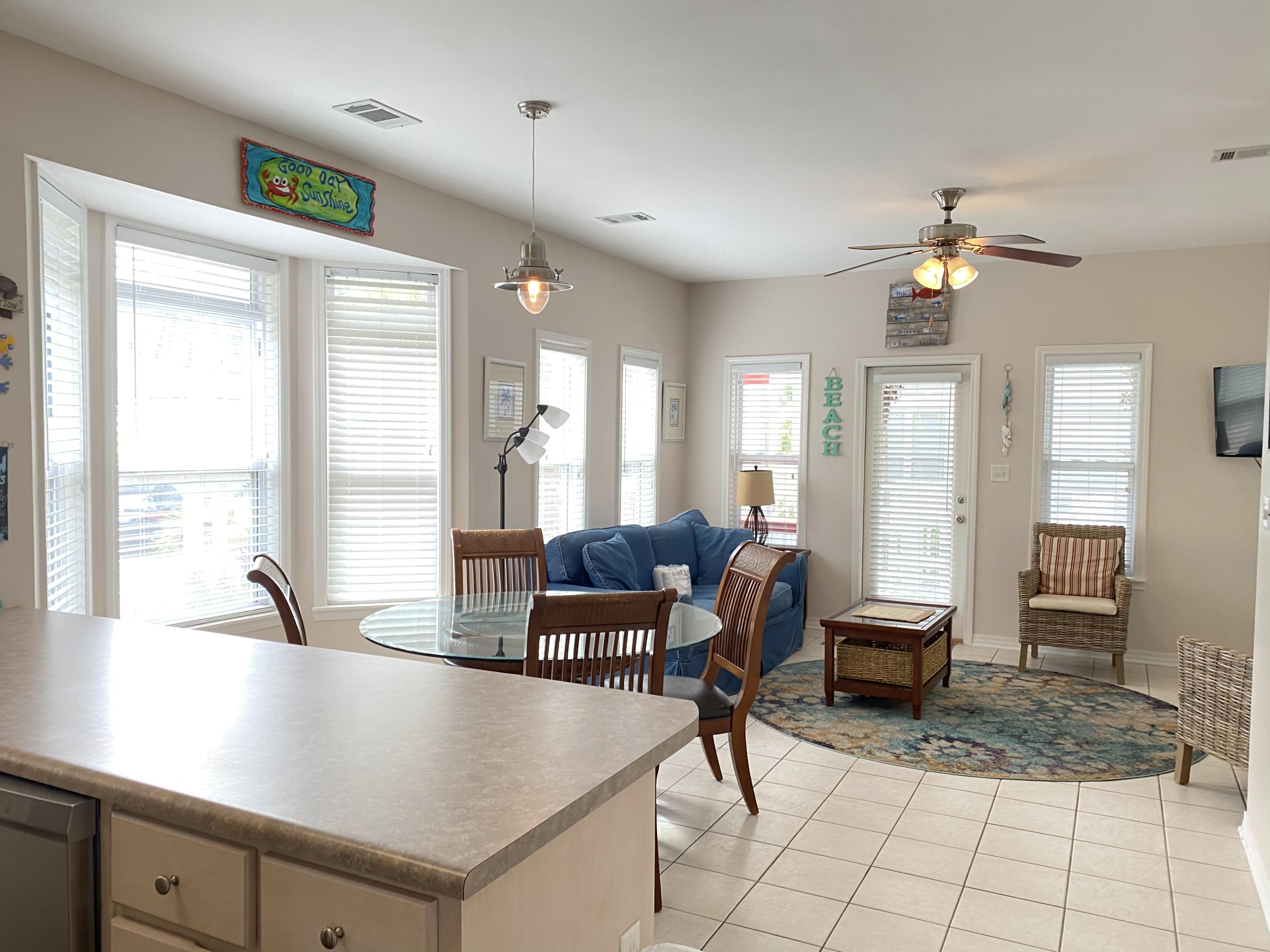 57 Emerald Dunes Circle Santa Rosa Beach, FL 32459 - Photo 4 of 26 a living room with furniture and large windows