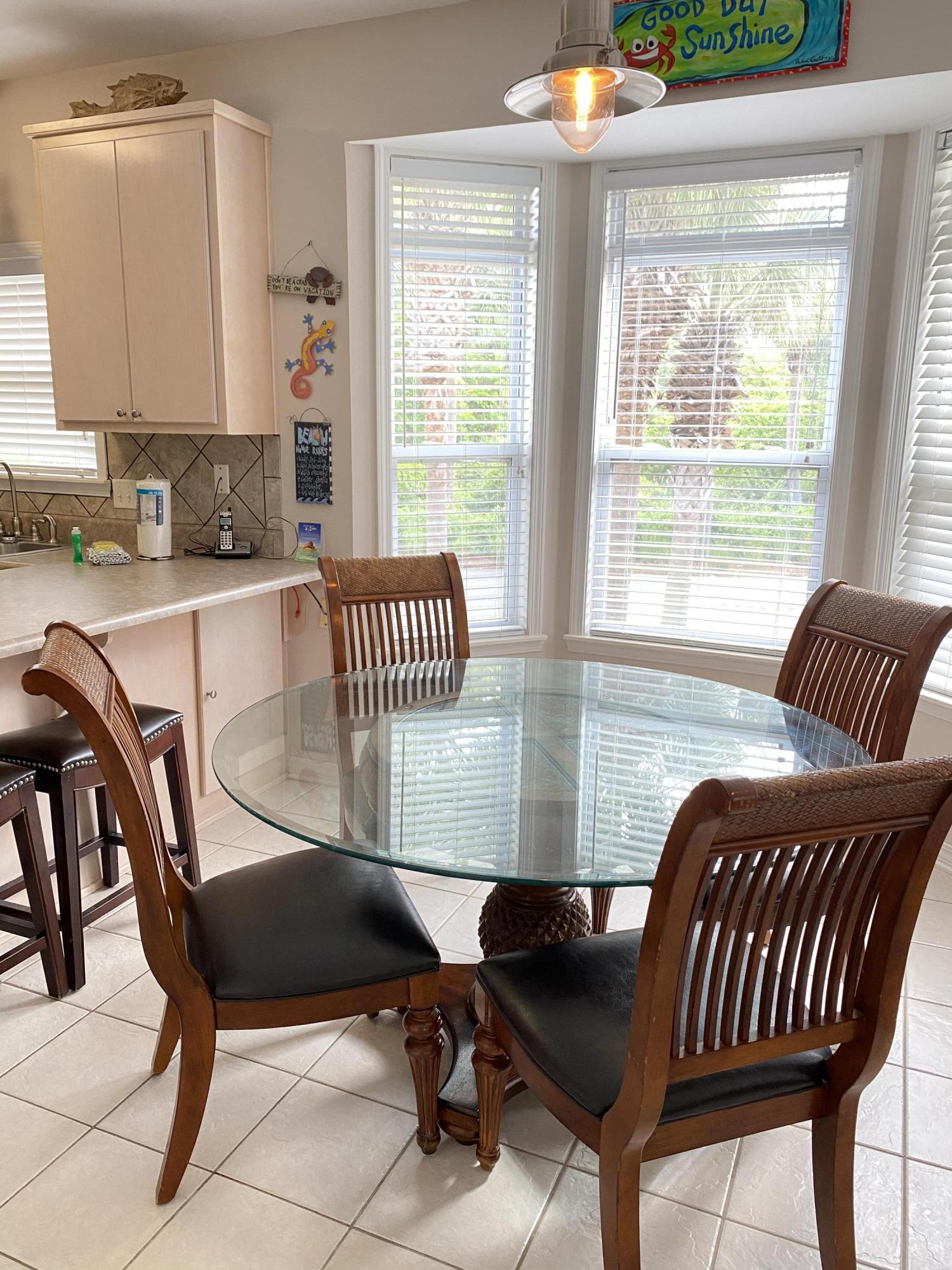57 Emerald Dunes Circle Santa Rosa Beach, FL 32459 - Photo 5 of 26 a view of a kitchen and dining room with furniture window and outside view