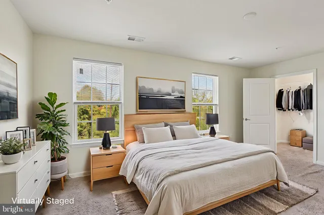 a bedroom with a bed and a couch