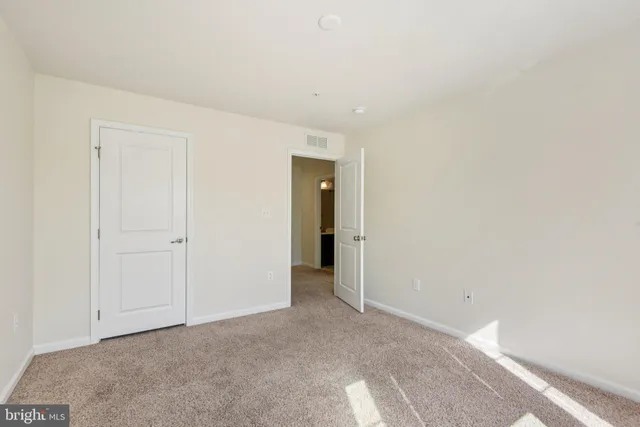 a view of a storage & utility room with a washer dryer