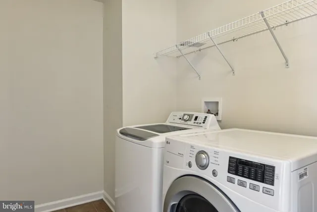 a view of room with stairs and wooden floor