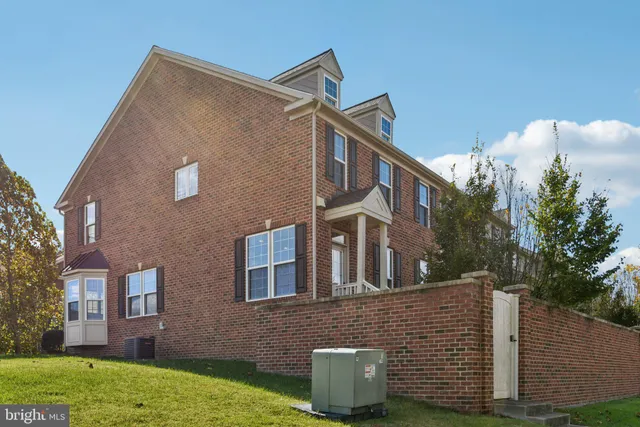 a brick building with a street sign on it