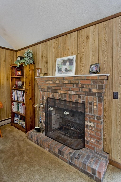 229 Number 9 Road Heath, MA 01367 - Photo 17 of 38 a room with fireplace and a bookshelf