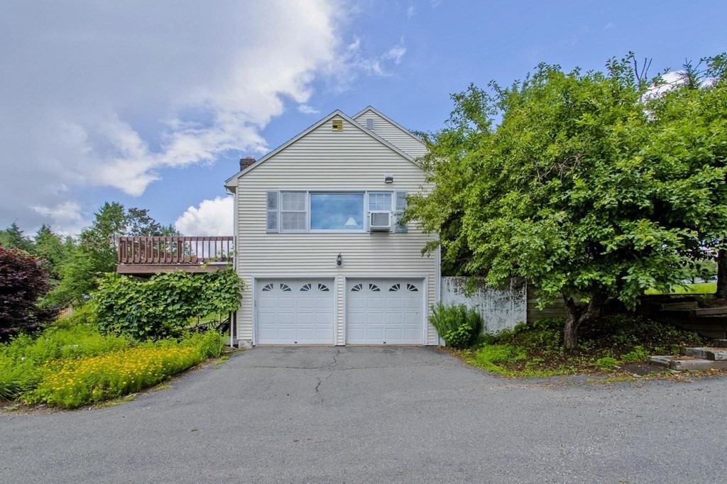 229 Number 9 Road Heath, MA 01367 - Photo 36 of 38 a front view of a house with a yard and garage
