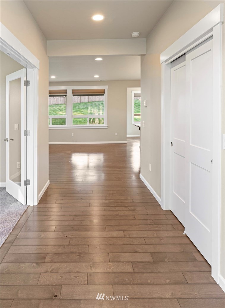 20 North Carpenter Road Snohomish, WA 98290 - Photo 4 of 21 an empty room with wooden floor and windows