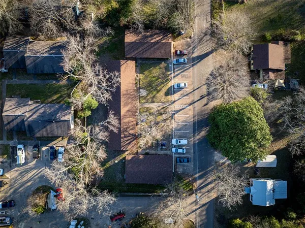 an aerial view of a houses with yard