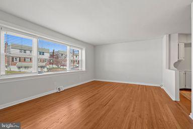 2712 Mower Street Philadelphia, PA 19152 - Photo 17 of 27 a view of an empty room with wooden floor and a window
