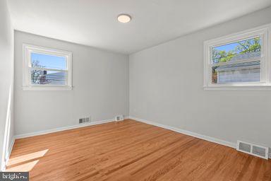 2712 Mower Street Philadelphia, PA 19152 - Photo 26 of 27 a view of an empty room with wooden floor and window