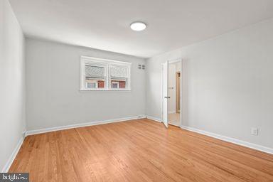 2712 Mower Street Philadelphia, PA 19152 - Photo 3 of 27 an empty room with wooden floor and windows