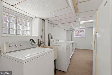 2712 Mower Street Philadelphia, PA 19152 - Photo 4 of 27 a utility room with dryer and washer