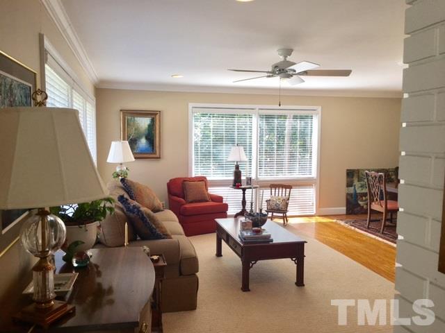 719 Beaver Dam Road Raleigh, NC 27607 - Photo 2 of 13 a living room with furniture and a large window