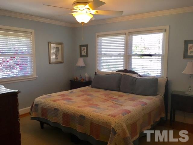 719 Beaver Dam Road Raleigh, NC 27607 - Photo 12 of 13 a bedroom with a bed and a window