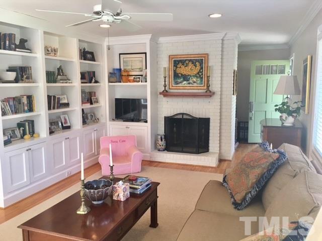 719 Beaver Dam Road Raleigh, NC 27607 - Photo 4 of 13 a living room with furniture and a fireplace