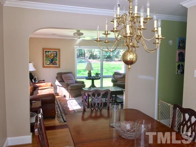 719 Beaver Dam Road Raleigh, NC 27607 - Photo 5 of 13 a view of a dining room with furniture window and outside view