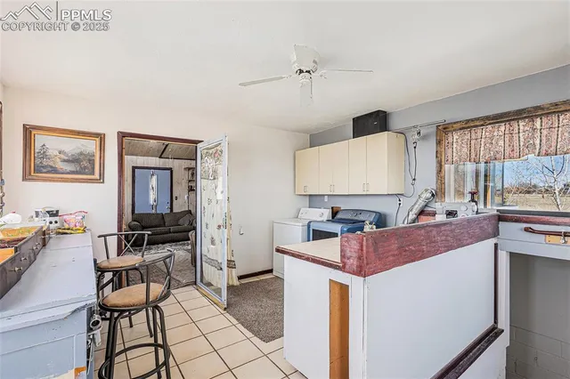 a view of kitchen with cabinets and outdoor living room