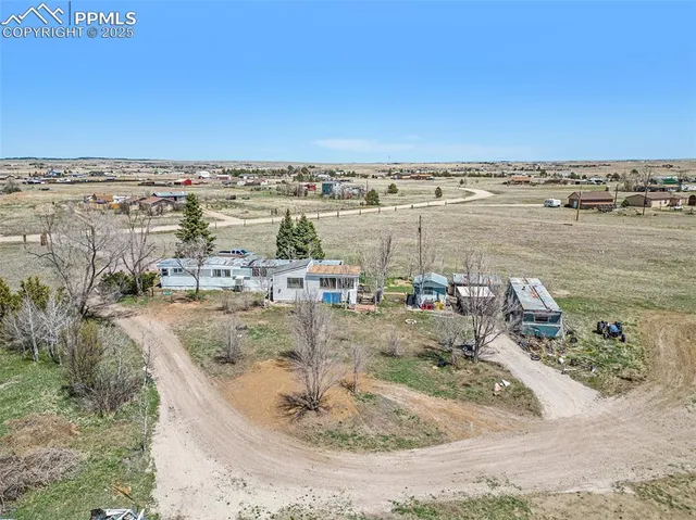 an aerial view of a house with a lake view