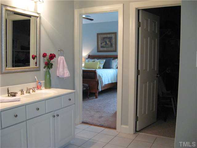 1001 Fieldgrass Place Raleigh, NC 27603 - Photo 13 of 20 Master bath, view of ms bedroom, tile floor, double vanity