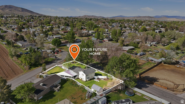 415 East 400 North Santaquin, UT 84655 - Photo 39 of 39 Aerial perspective showcasing a residential property with a multi-level structure and an expansive green lawn