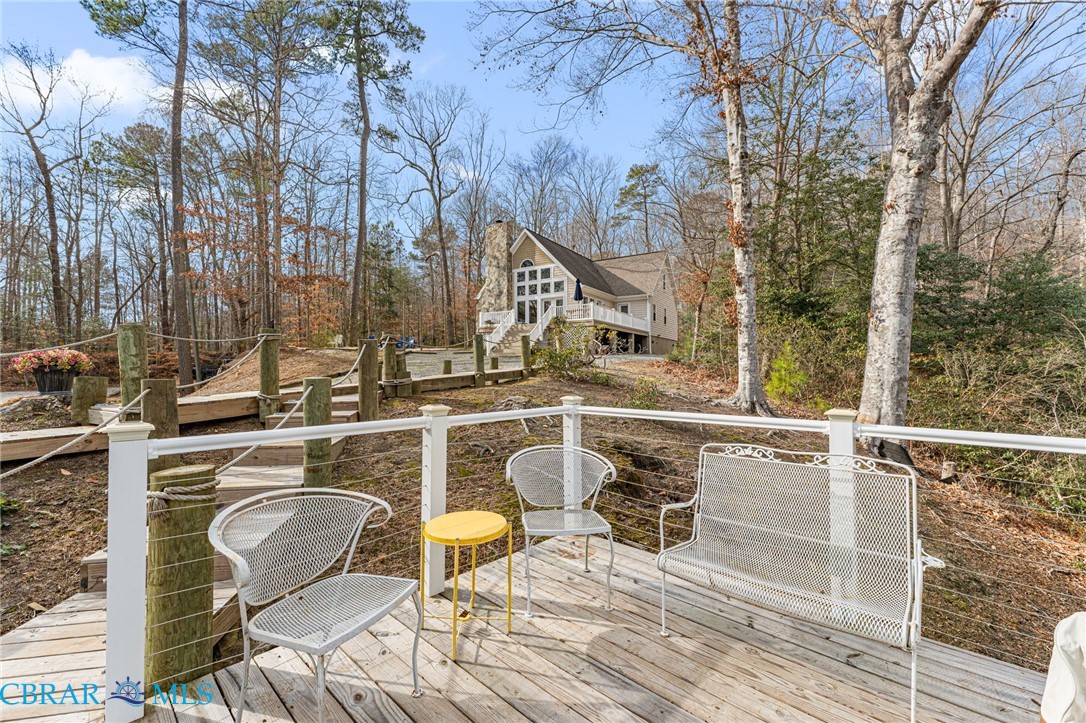 4775 Stormont Road Hartfield, VA 23071 - Photo 14 of 45 Wooden terrace with view of wooded area