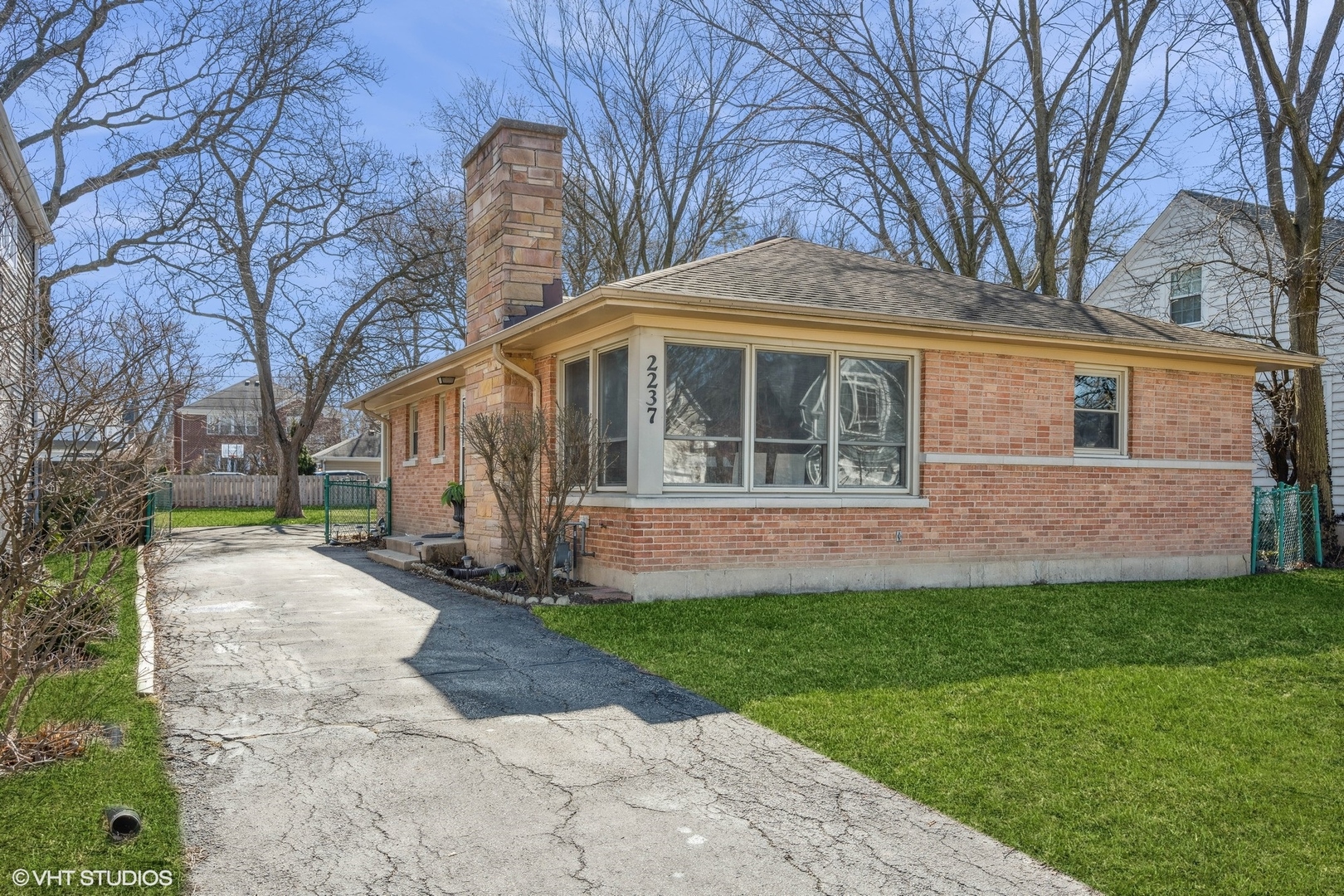 a view of house with a yard