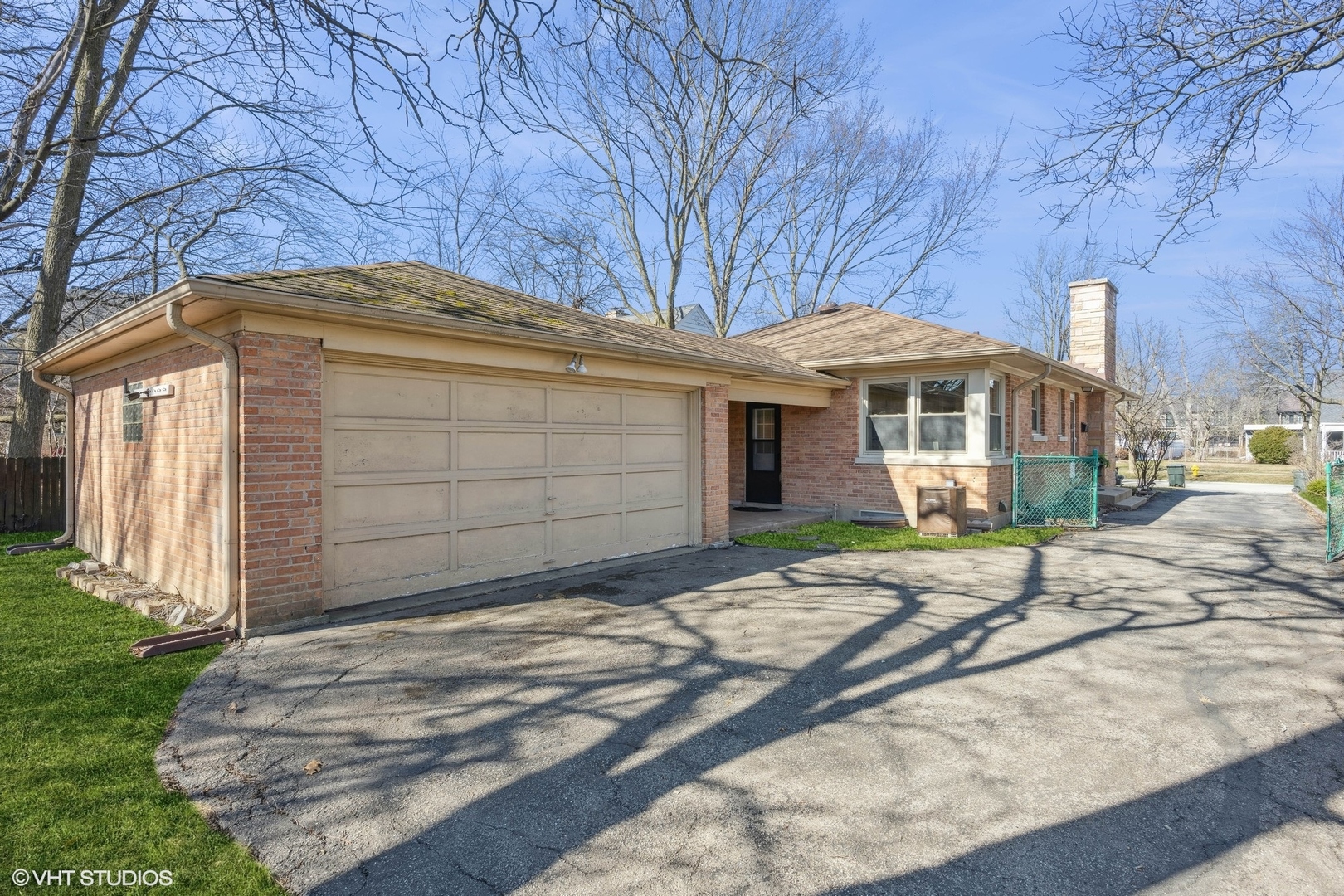 2237 Dewes Street Glenview, IL 60025 - Photo 17 of 20 a front view of a house with a garden