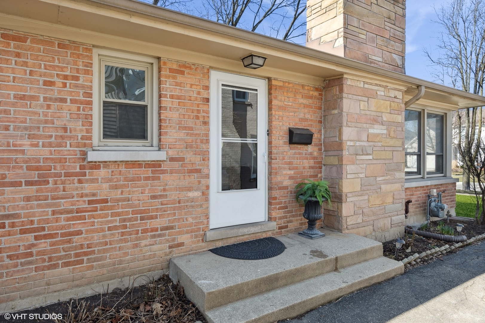 2237 Dewes Street Glenview, IL 60025 - Photo 2 of 20 a bathroom with a sink and a potted plant