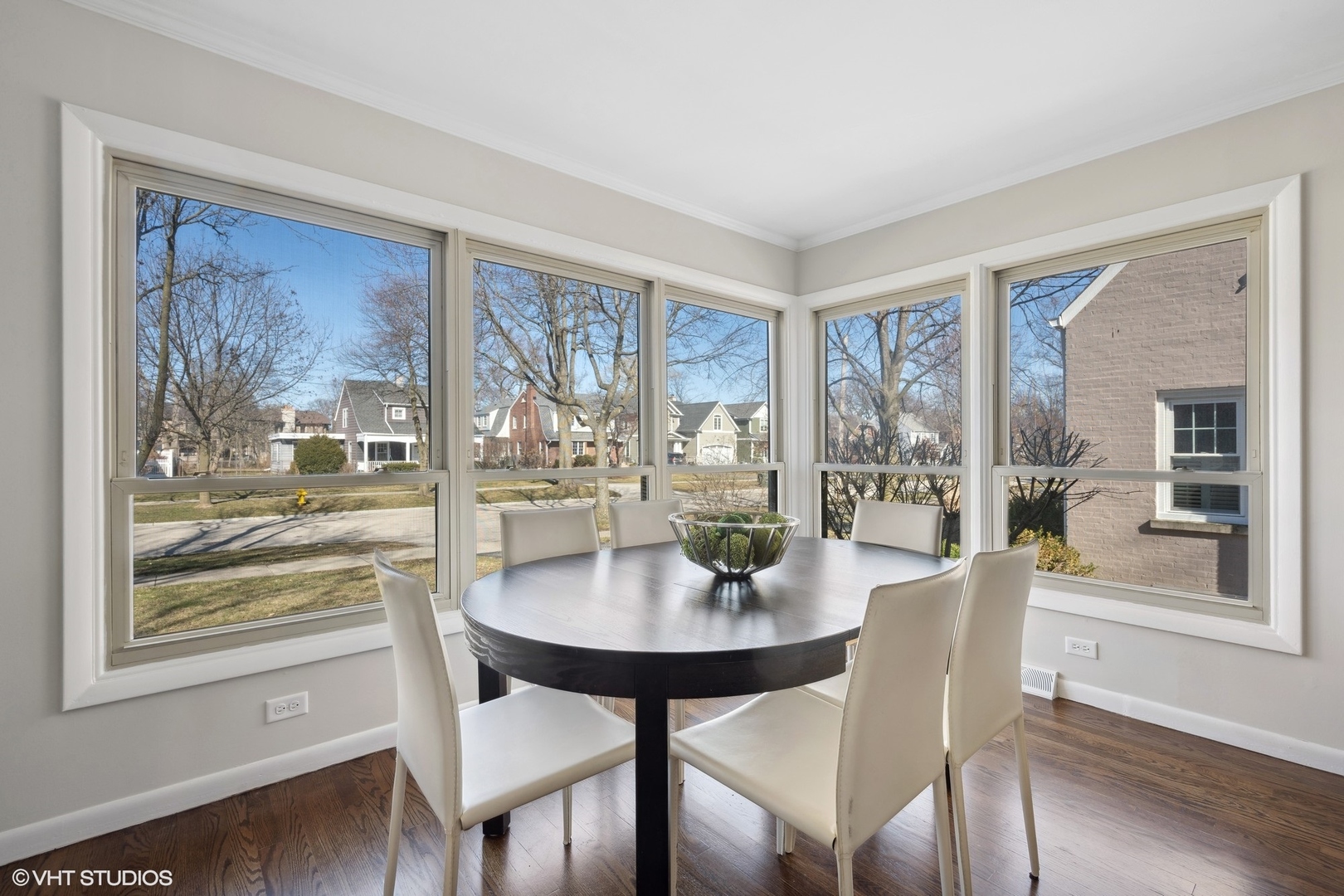 2237 Dewes Street Glenview, IL 60025 - Photo 5 of 20 a dining room with furniture a painting and wooden floor