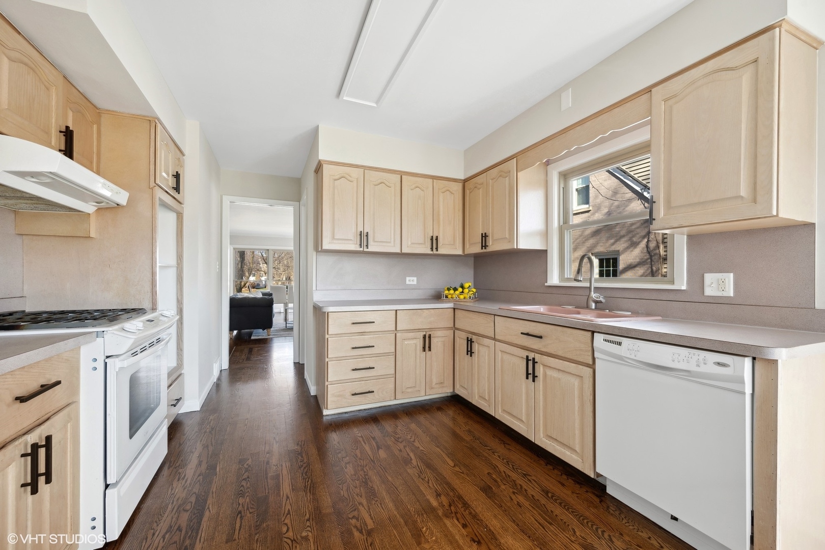 2237 Dewes Street Glenview, IL 60025 - Photo 7 of 20 a kitchen with granite countertop white cabinets and white appliances