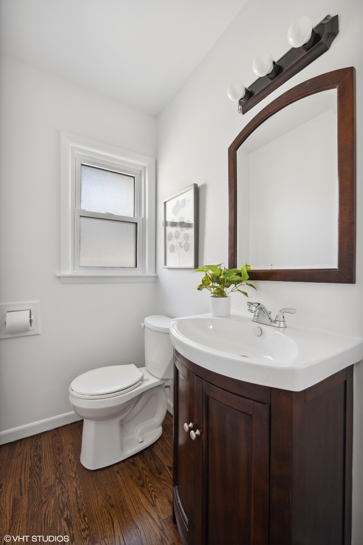 2237 Dewes Street Glenview, IL 60025 - Photo 9 of 20 a bathroom with a sink toilet and mirror