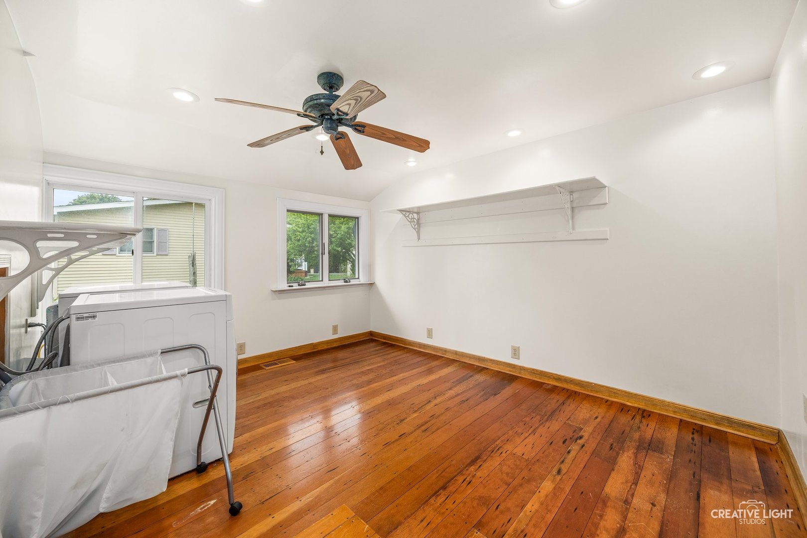 209 North Shabbona Road Shabbona, IL 60550 - Photo 9 of 25 a view of empty room with wooden floor and fan