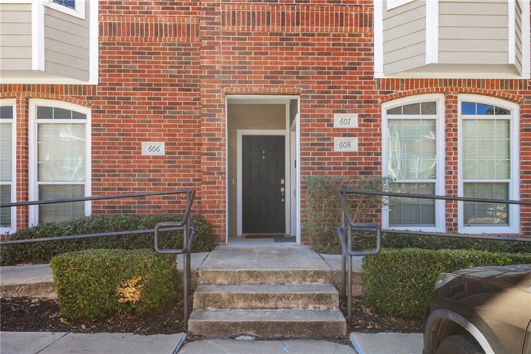 1198 Jones-Butler Road, Unit 606 College Station, TX 77840 - Photo 2 of 32 a front view of a house with a garden
